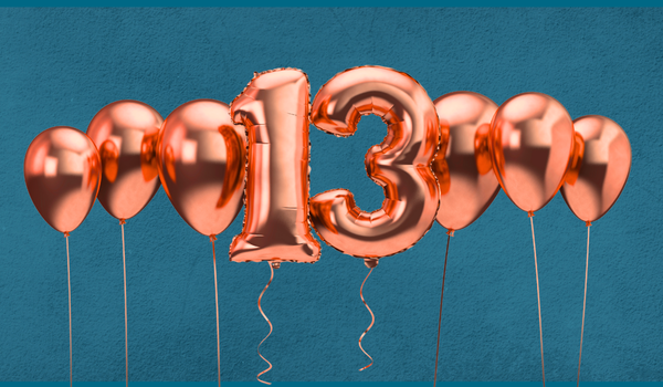 Image of orange balloon bunch and feature 13 balloons on blue background