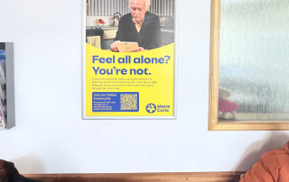 Image of a Marie Curie advert on a poster panel advert in hospital waiting room