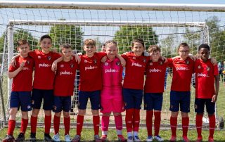 Ebbsfleet United Whites U10s team in front of the goal at SELKENT final
