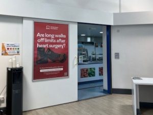 Image of poster advert on hospital wall with British Heart Foundation campaign