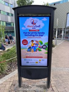 Image of D6 digital screen showing Heart and Stroll event advertising