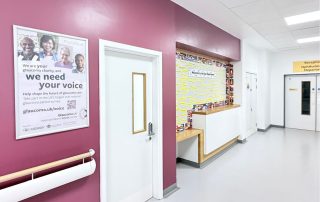 Image of a poster with Glaucoma UK campaign in hospital corridor