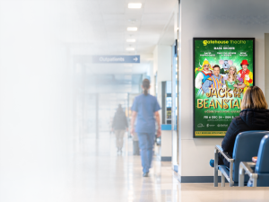 Image of hospital waiting room with digital screen advertising panto