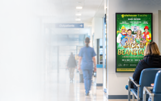 Image of hospital waiting room with digital screen advertising panto