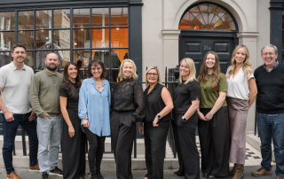 Photo of Pulse Outdoor Media team standing outside office in London